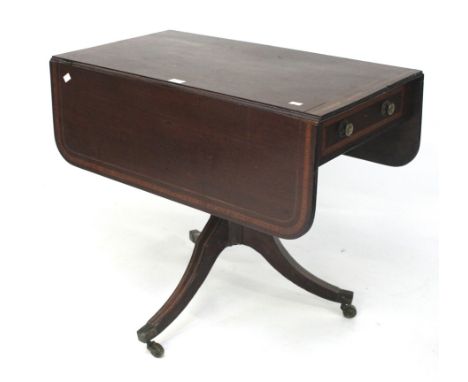 An Edwardian inlaid mahogany drop leaf centre table. With single drawer and one dummy drawer, raised on a sabre tripod base, 