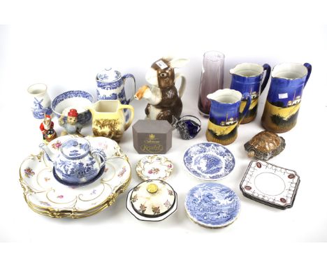 An assortment of ceramics and glassware. To include a large Wade tortoise, Caithness Penguin paperweight and more