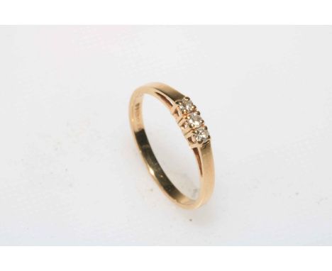 Diamond three stone 9 carat gold ring, size O.