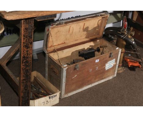 Collection of tools including oil burners, saws, etc.