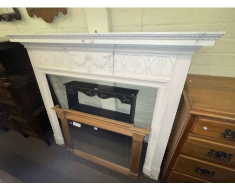 Painted fire surround, pine framed overmantel mirror and painted two drawer open wall rack (3).