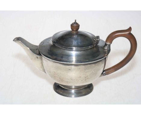 Silver teapot with plain circular body, 15.5cm high, London 1945.