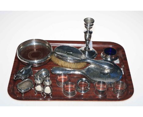 Tray lot of silver pieces comprising bottle coaster, five napkin rings, brush and mirror, five cruets, candlestick, and open 