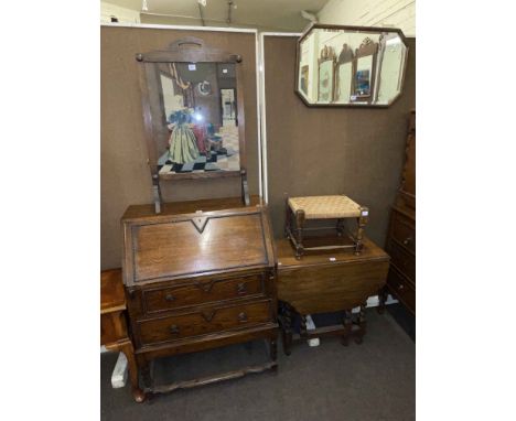 1920's oak two drawer bureau, oak barley twist gate leg dining table, rush seated stool, oak framed bevelled wall mirror and 