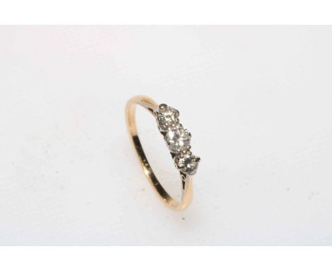 Three stone diamond gold ring, tests as 18 carat, size L.