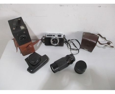 A collection of cameras including a Six 20 Popular Brownie, a Ross Ensign Ful- Vue super, a Minolta Minotina-S. Also includes