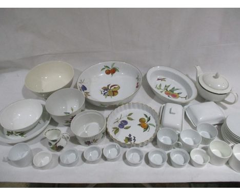 A collection of various Royal Worcester bowls and dishes including Evesham, along with a Royal Doulton teapot, Honiton butter