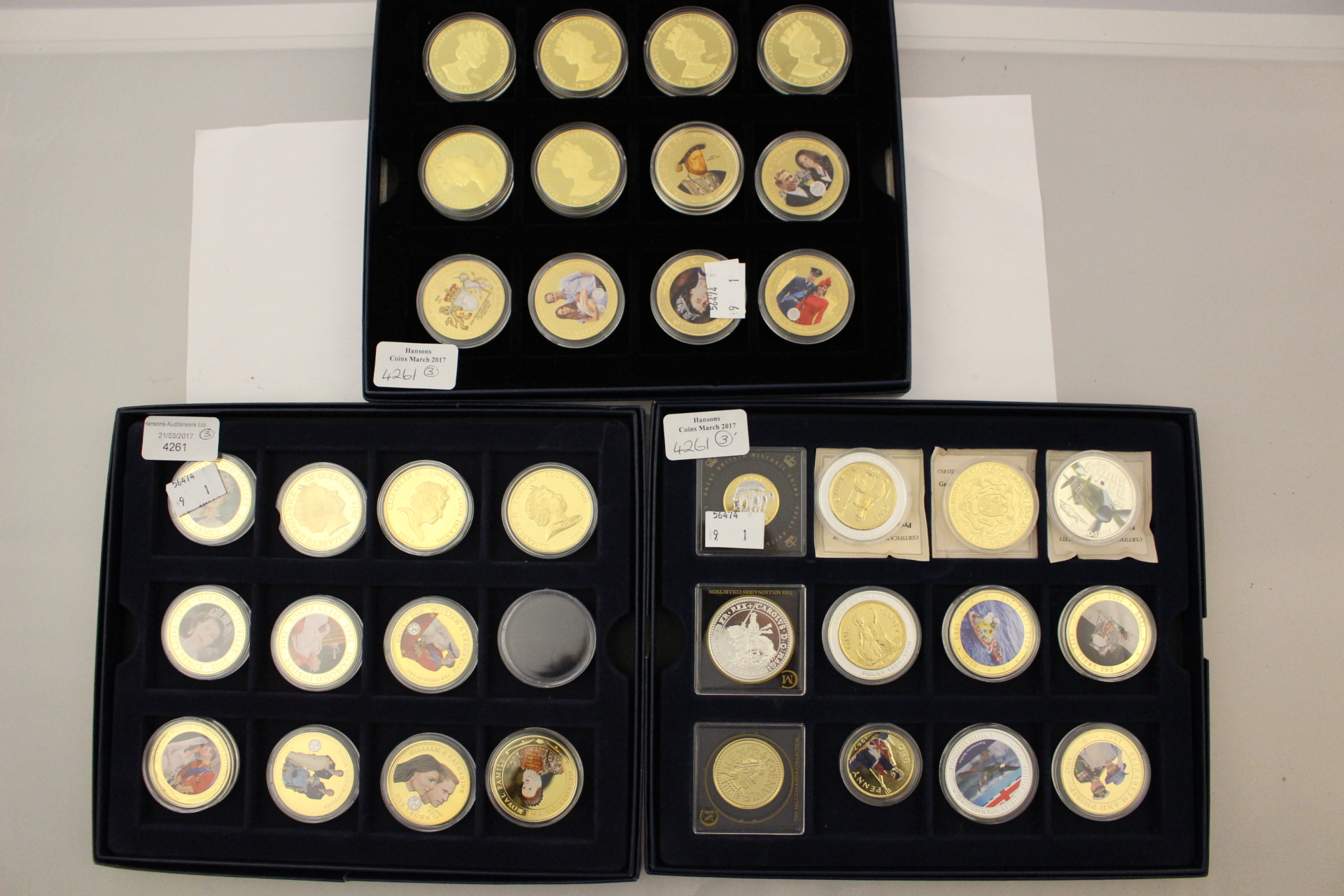 Three Westminster Blue card coin cases holding 35 Enamel Gold and Silver Plated coins, Commemorat