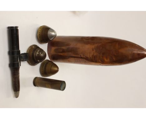 WW1 Imperial German 77mm shell fuze, two other WW1 shell fuzes, 20mm aircraft cannon round (inert) with link, 30mm brass belt
