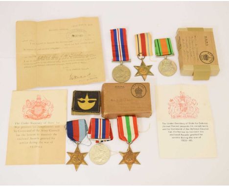 Second World War medal trio comprising; 1939-45 War Medal, Defence Medal and Africa Star, the box addressed to 'Mrs. B Thobur