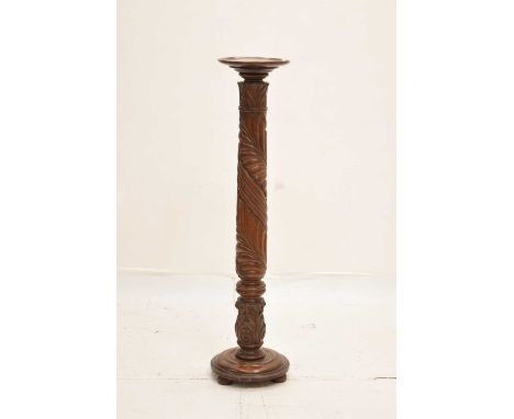 Carved mahogany torchère raised on turned step base, 26cm diameter x 122cm high, together with a similar example converted to