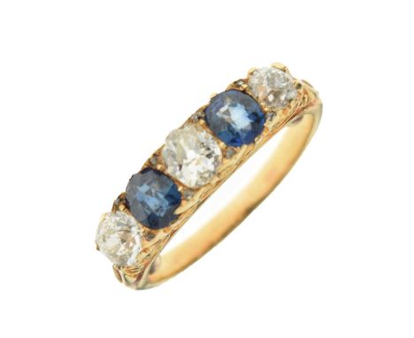 Five-stone diamond and sapphire ring, comprising three old cut diamonds and two oval cut sapphires, the yellow metal mount un