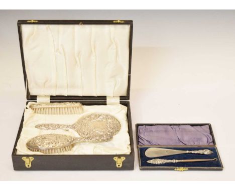 Cased Elizabeth II silver-backed dressing table set, Birmingham 1973, and a silver handled shoe horn and button hook