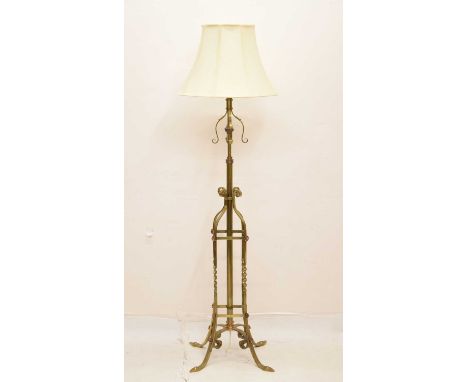 Early 20th century brass and copper standard lamp, of tubular construction with adjustable stem, the square section openwork 