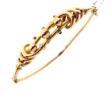 Unusual hinged hollow bangle, the yellow metal stamped '9ct', 6.9g approx (a/f)