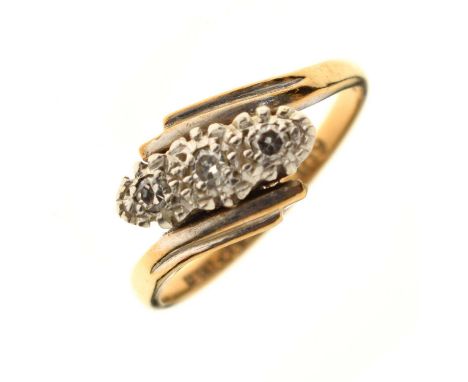 Diamond three-stone crossover ring, the diamonds illusion set in white metal, the yellow metal shank stamped '18ct Plat', siz