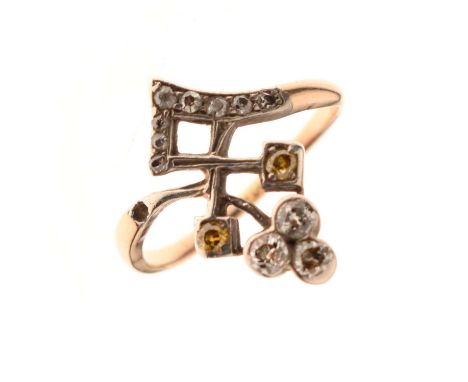 Diamond and yellow diamond tiara-style ring, the diamond set v-shaped band having a trefoil cluster above and two yellow diam