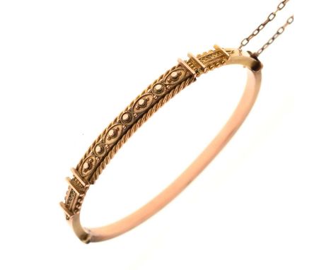 Late 19th century 9ct rose gold hinged bangle, the upper half with rope twist and granulation decoration, tongue and box clas