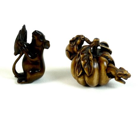 Two Japanese boxwood netsuke, Meiji period, one modelled as two mice eating a pumpkin, with one mouse nibbling on a stalk whi