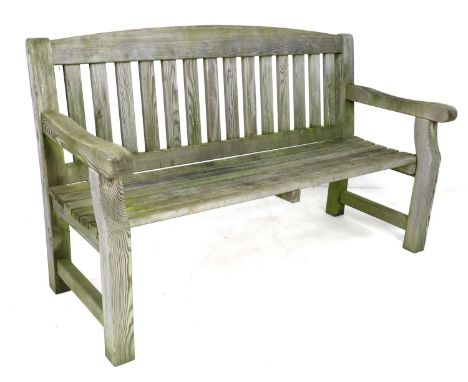A modern wooden garden bench, slat back and open arms, 154 by 60 by 94.5cm high. 