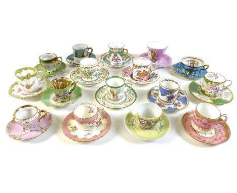 A group of sixteen coffee cups and saucers, in pastel shades. 