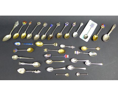 A collection of thirty predominantly 20th century British silver commemorative teaspoons, including some with enamel decorati