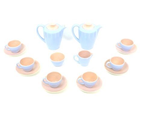 A 1950s Poole Pottery twin tone peach bloom and mist blue coffee set, pattern no. 'C100', comprising two coffee pots, both 16