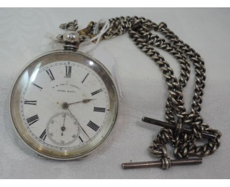 A white metal key wound pocket watch stamped 935 having a Roman numeral dial with subsidiary seconds to white face marked H E