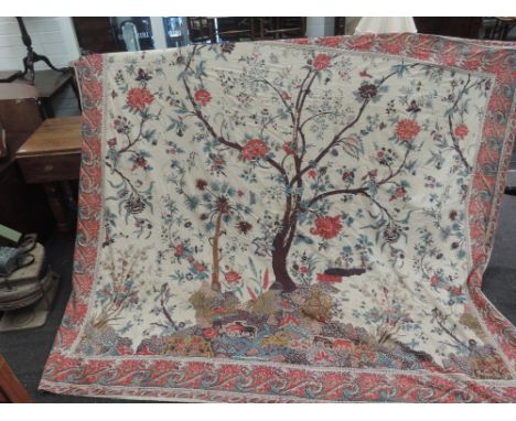 A huge throw/bed covering having a wonderful oriental type print with flowers vines and birds etc, a little wear to an area i