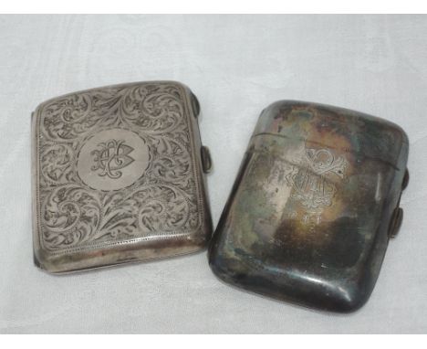 A silver cigarette case having engraved scroll decoration and monogrammed cartouche, Birmingham 1922, William Hair Heseler (c