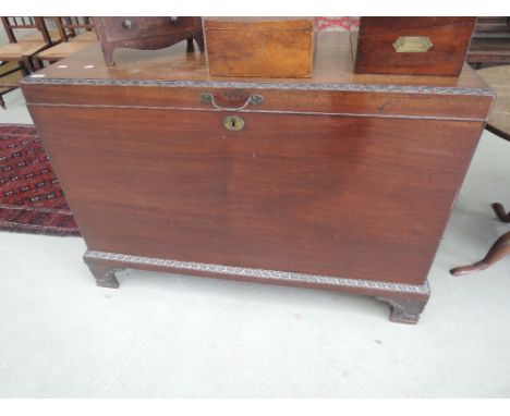 A 19th century mahogany kist having carved foliate border detail, on bracket feetTop marked and cracked,age related wear woul