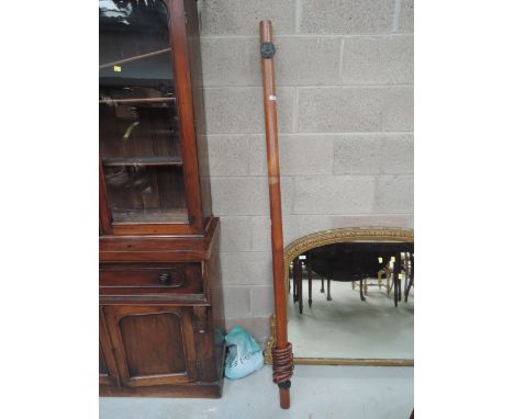 A vintage mahogany curtain pole and fitments