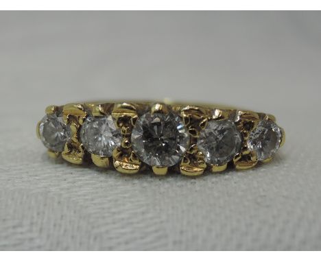 A lady's dress ring having five graduated old cut diamonds, total approx 1ct in a gallery mount on an 18ct gold loop, size K