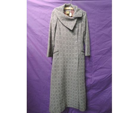 A vintage full length BIBA coat in purple, blue and grey wool. Great condition with a few nips to lining, around a medium siz