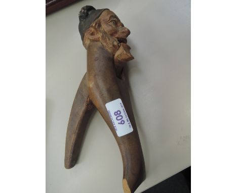 A set of vintage treen nutcrackers modelled as Austrian gent