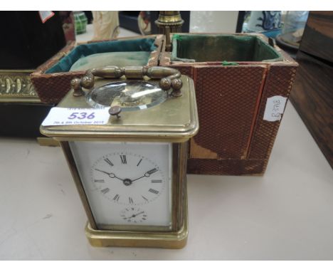 A 19th century brass traditional design French carriage dial clock, engraved Aigulles, with case