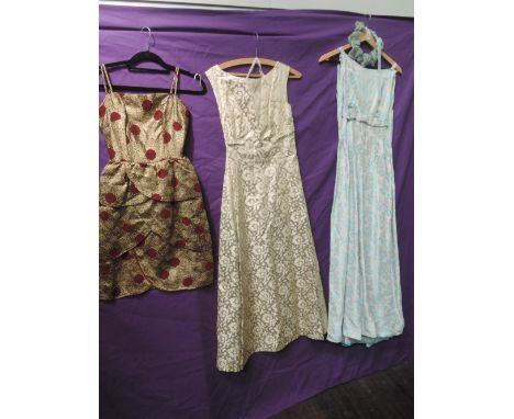 A lot of three vintage 1950s dresses, two full length and one shorter with peplum detailing. Small sizes and all in great con