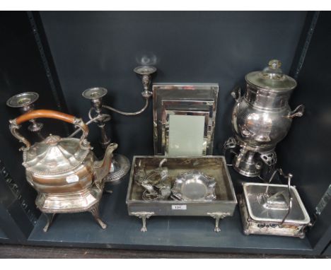 A selection of silver plate including two spirit kettles, photograph frames, candelabrum, planter etc