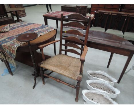 Two 19th century beech and elm vernacular ladder back armchairs having rush seats and turned frame