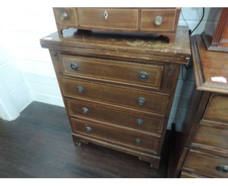 A late 20th century mahogany period style dressing chest having fold out brush top on inlay drawers and bracket feet