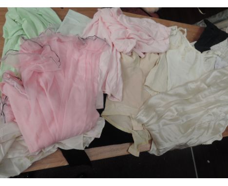 A box of vintage lingerie, girdles and nightwear. Mainly mid century, in nylon and various other fabrics.