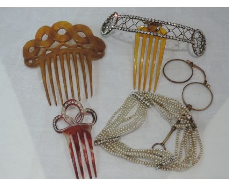 A selection of vintage jewellery including hair combs, a lorgnette and an eight strand seed pearl choker with four diamante s