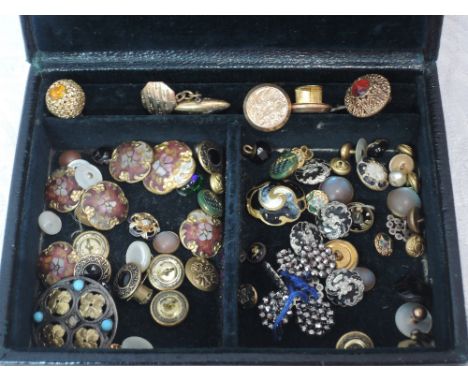 A vintage jewellery box containing a selection of antique buttons including cut steel, enamelled, rolled gold etc