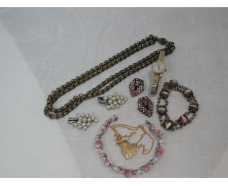 A small selection of vintage and modern costume jewellery including white metal collar clips, white metal and mother of pearl