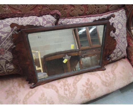 A late 19th century mahogany frame wall mirror in The Chippendale revival style