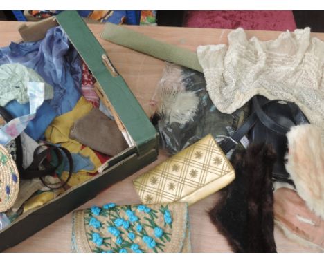 A really varied lot of vintage and antique containing some early clothing, stage clothing,dolls clothing , scarves/shawls, be