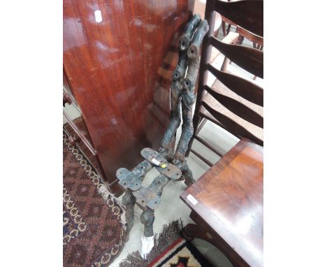 A pair of Victoria design cast iron bench ends of naturalistic branch style