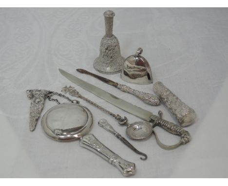 A selection of HM silver and white metal including bells, powder compact, souvenir spoon etc