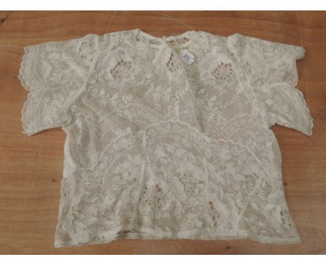 Pretty lace blouse, around 1930s having fluted sleeves and beautiful details throughout. Small size,Very good condition for a