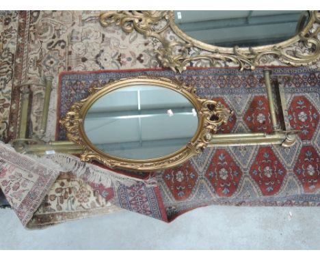 A vintage brass fire curb having Art Nouveau inspired design and a mid 20th century period style wall mirror